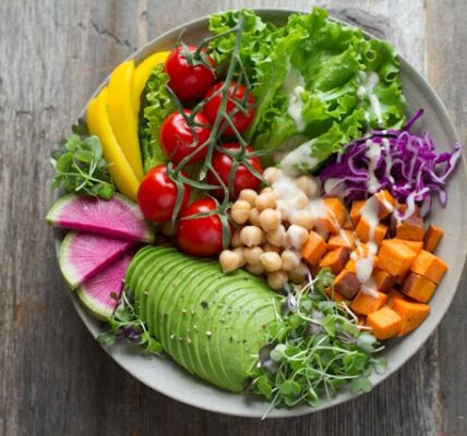 Fresh vegan salad bowl on a wooden table at a restaurant in Minato Tokyo